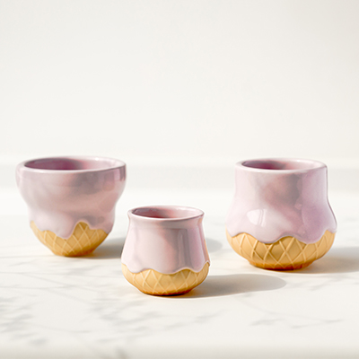 Set of three unique ceramic coffee tasting cups featuring a pink glaze drip and waffle cone textured base design.